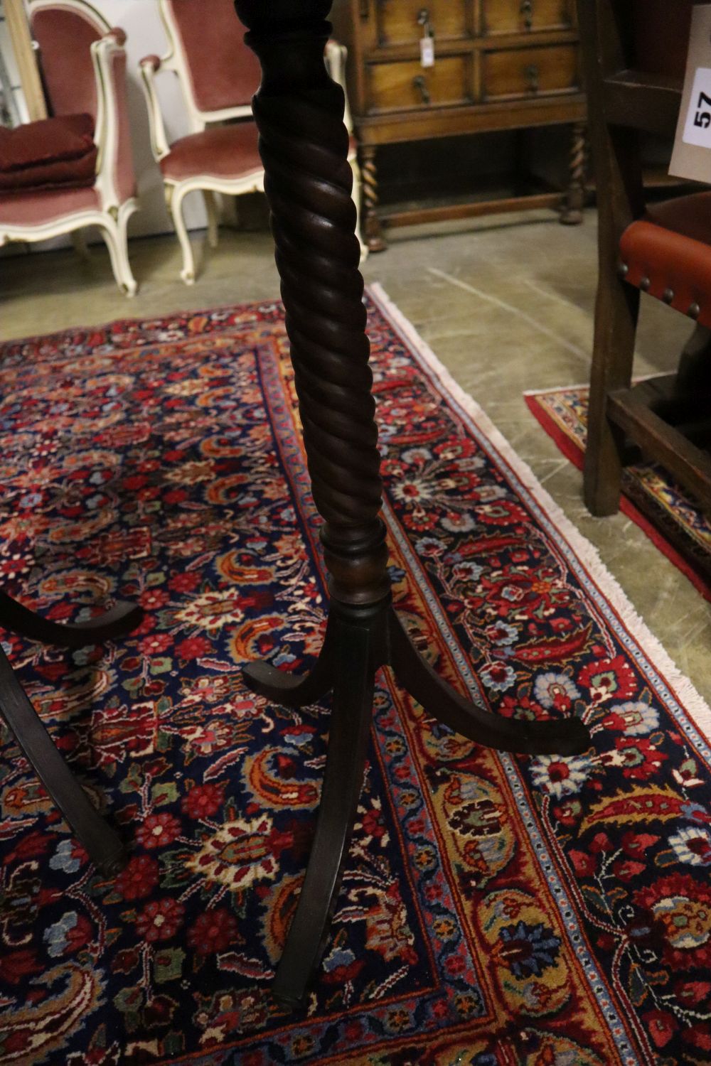 A pair of Regency design octagonal mahogany tripod wine tables, width 45cm, depth 39cm, height 75cm